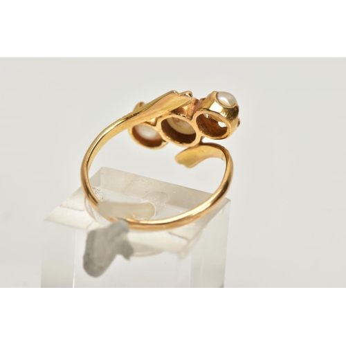 147 - A YELLOW METAL CULTURED PEARL THREE STONE RING, of openwork design, comprising two split and one cul... 