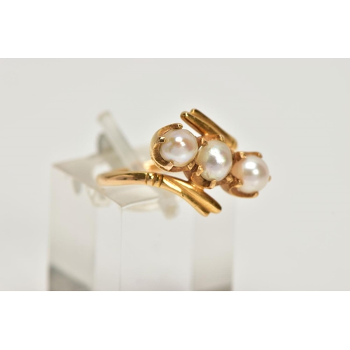 147 - A YELLOW METAL CULTURED PEARL THREE STONE RING, of openwork design, comprising two split and one cul... 