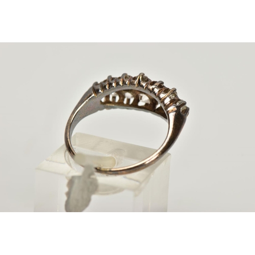 151 - AN OLD CUT DIAMOND DRESS RING, the graduated old cut diamond rows, with openwork gallery and tapered... 