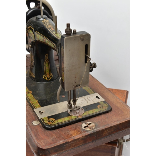 160A - A BRADBURY'S FAMILY V.S. MANUAL SEWING MACHINE, in working condition with wooden case