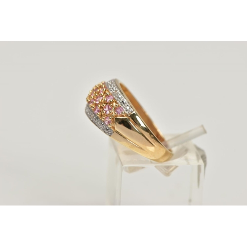 169 - A 14CT GOLD SYNTHETIC PINK SAPPHIRE AND DIAMOND DRESS RING, comprising synthetic pink sapphire rows ... 