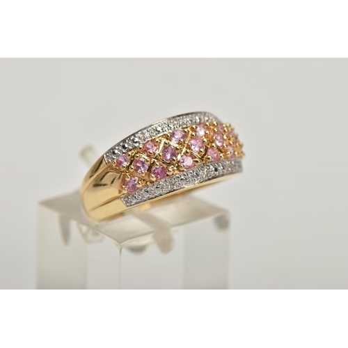 169 - A 14CT GOLD SYNTHETIC PINK SAPPHIRE AND DIAMOND DRESS RING, comprising synthetic pink sapphire rows ... 