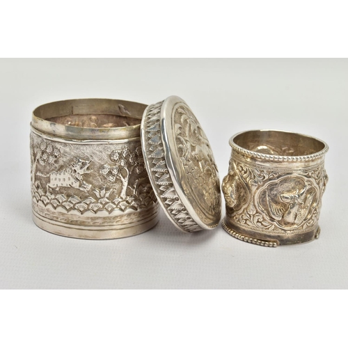 179 - TWO EARLY 20TH CENTURY ITEMS, the first an embossed unmarked white metal pot depicting a hunting sce... 