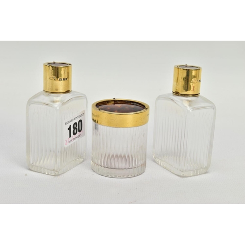 180 - A SET OF THREE EARLY 20TH CENTURY GUILTED SILVER AND TORTOISESHELL GLASS BOTTLES, each hallmarked Lo... 