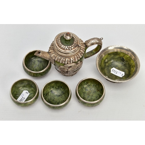 181 - A JADE AND WHITE METAL TEA SET, of decorative oriental design, to include a tea pot with lid and dra... 