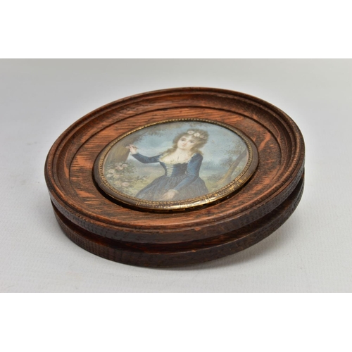 184 - A WOODEN PORTRAIT MINIATURE, depicting a Georgian lady within a garden painting onto a tree, with gl... 