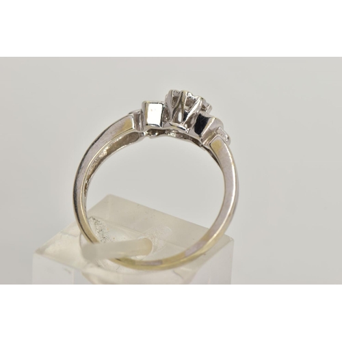 20 - A 9CT WHITE GOLD DIAMOND RING, centring on an illusion set round brilliant cut diamond, flanked with... 