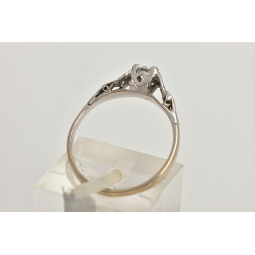 22 - A WHITE METAL DIAMOND RING, centring on a four claw set, round brilliant cut diamond, estimated diam... 