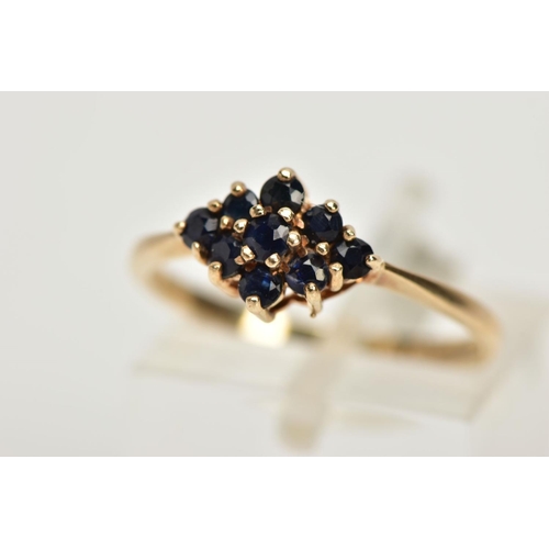 24 - A 9CT GOLD SAPPHIRE CLUSTER RING, tiered cluster of a navette shape, set with nine circular cut deep... 
