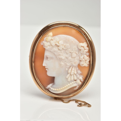 3 - A YELLOW METAL CAMEO BROOCH, of an oval form, depicting a lady in profile, collet mount with a plain... 