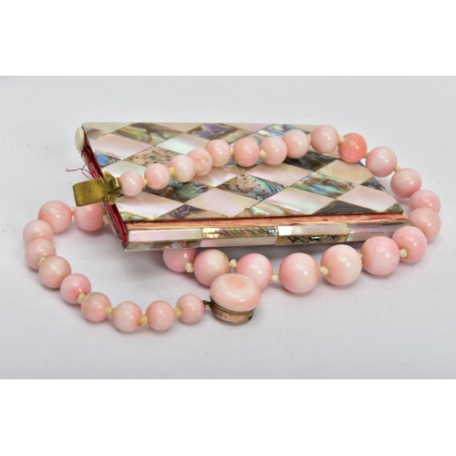 32 - A CERAMIC BEAD NECKLACE AND AN AIDE MEMOIRE, a graduated pink glazed ceramic bead necklace, fitted w... 
