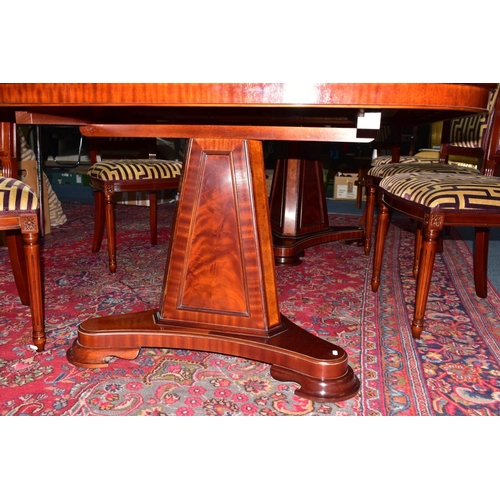 445A - A CHARLES BARR MAHOGANY AND BURR WOOD INLAID EXTENDING PEDESTAL DINING TABLE, with one additional le... 