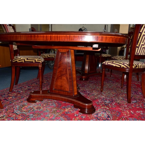 445A - A CHARLES BARR MAHOGANY AND BURR WOOD INLAID EXTENDING PEDESTAL DINING TABLE, with one additional le... 