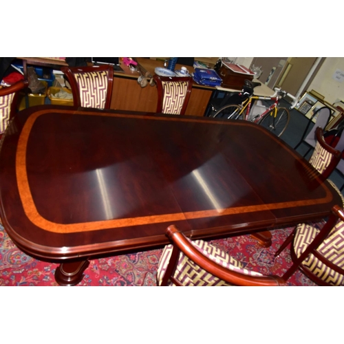 445A - A CHARLES BARR MAHOGANY AND BURR WOOD INLAID EXTENDING PEDESTAL DINING TABLE, with one additional le... 