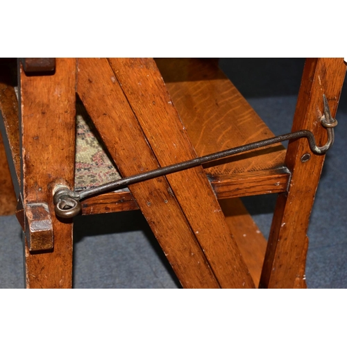 455A - A VICTORIAN OAK GOTHIC STYLE METAMORPHIC CHAIR/LIBRARY STEPS, with quatrefoils to the bar back, and ... 