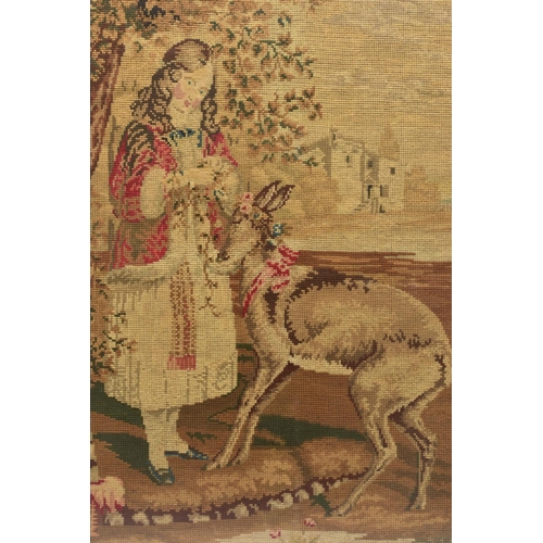 505A - A VICTORIAN HAND SEWN TAPESTRY DEPICTING A YOUNG FEMALE FIGURE PUTTING FLOWER GARLANDS ONTO A DEER, ... 