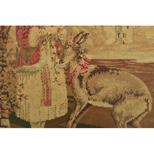 505A - A VICTORIAN HAND SEWN TAPESTRY DEPICTING A YOUNG FEMALE FIGURE PUTTING FLOWER GARLANDS ONTO A DEER, ... 