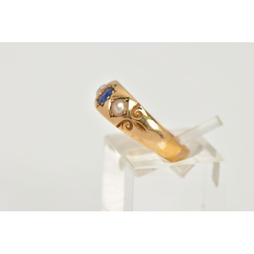 55 - A LATE VICTORIAN 18CT GOLD RING, centring on a star set, cushion cut blue sapphire, flanked with spl... 