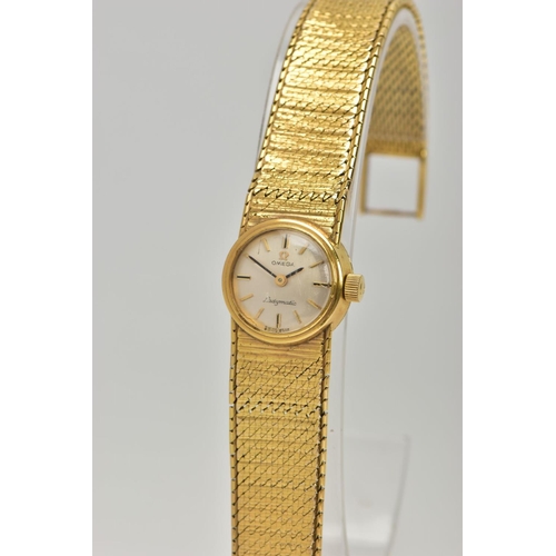 67 - A LADIES 9CT GOLD 'OMEGA' WRISTWATCH, a hand wound movement, round silver tone dial signed 'Omega La... 