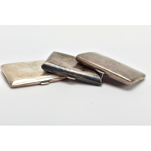 69 - THREE SILVER CIGARETTE CASES, the first of a curved rectangular form, plain polished design with eng... 