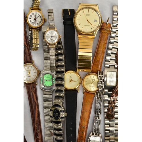 83 - A TIN OF ASSORTED WRISTWATCHES, mostly quartz movements, to include ladies and gents watches with na... 