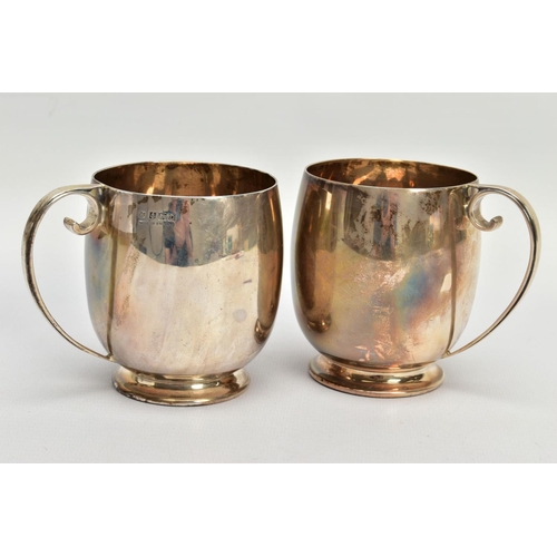 85 - A PAIR OF SILVER CUPS, each of a plain polished design, personal engraving reads 'M.C & M.T.G.S Spri... 