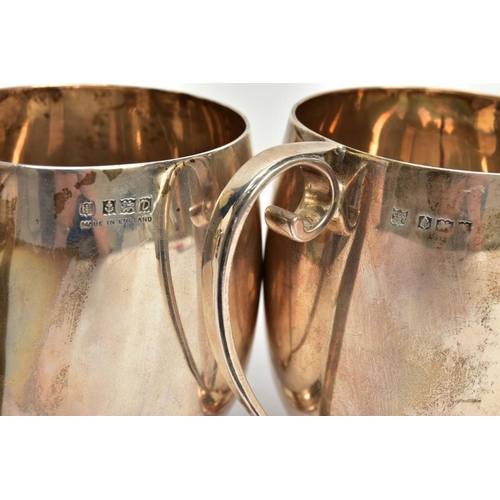 85 - A PAIR OF SILVER CUPS, each of a plain polished design, personal engraving reads 'M.C & M.T.G.S Spri... 