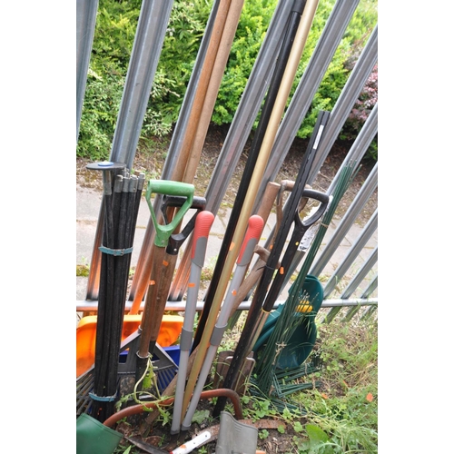 1201 - A SELECTION OF GARDEN TOOLS, to include two spades, one shovel, a rake, axe, show plough, plastic wh... 