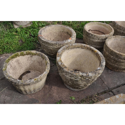 1207 - A SET OF FOUR COMPOSITE BARREL TYPE CIRCULAR PLANTERS, diameter 30cm x height 21cm, along with a pai... 