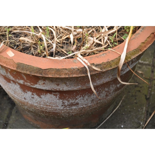 1226 - A PALE BLUE GLAZED CIRCULAR GARDEN PLANTER, raised on three supports, diameter 51cm x height 46cm, a... 