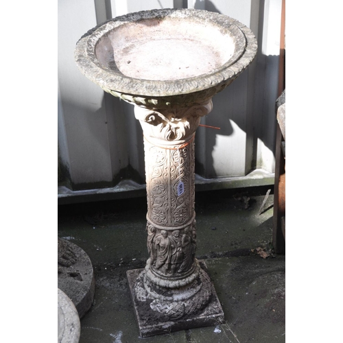 1230 - A COMPOSITE BIRD BATH, on a pattered Corinthian column support with religious figures to bottom half... 