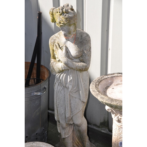 1231 - A COMPOSITE GARDEN FIGURE, of a standing scantily clad lady, in flowing robes, height 119cm