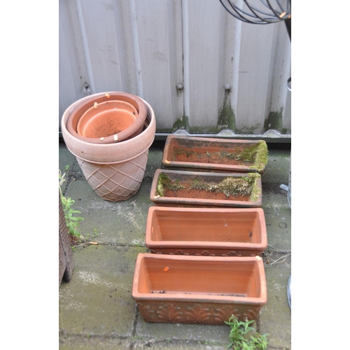 1233 - A SET OF FOUR TERRACOTTA RECTANGULAR PLANTERS, and two circular terracotta planters, along with a ga... 