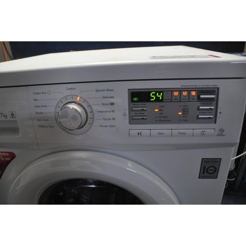 1297 - AN LG DIRECT DRIVE 7KG WASHING MACHINE (PAT pass and powers up but not tested any further)