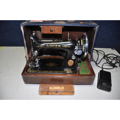 1313 - A SINGER SEWING MACHINE with foot pedal and light in blue case (PAT pass and working)