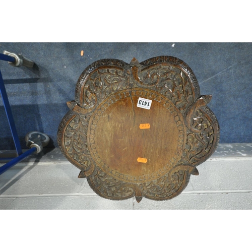 1413 - A 19TH CENTURY ANGLO INDIAN HEAVILY CARVED PADOUK OCCASIONAL TABLE, the top with foliate detail surr... 