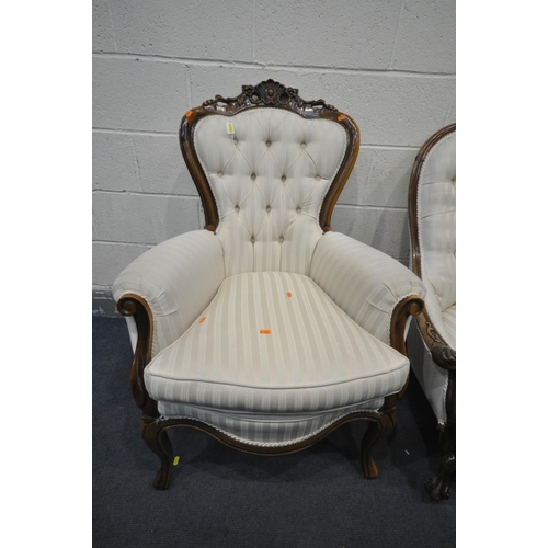 1415 - A VICTORIAN WALNUT BUTTONED SPOON BACK ARMCHAIR, with cream stripped upholstery, on ball and claw fr... 