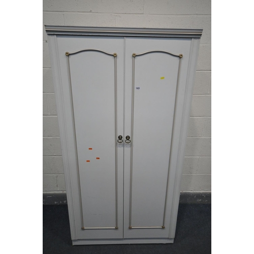 1431 - A MATCHED WHITE PAINTED FRENCH STYLE FOUR PIECE BEDROOM SUITE, comprising a double door wardrobe, wi... 