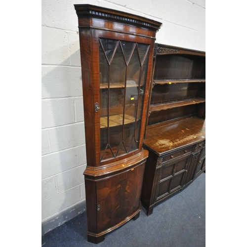 1432 - A 20TH CENTURY OAK DRESSER, the top with two tier plate rack, the base with three drawers and two cu... 