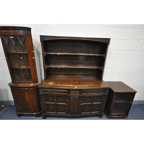 1432 - A 20TH CENTURY OAK DRESSER, the top with two tier plate rack, the base with three drawers and two cu... 