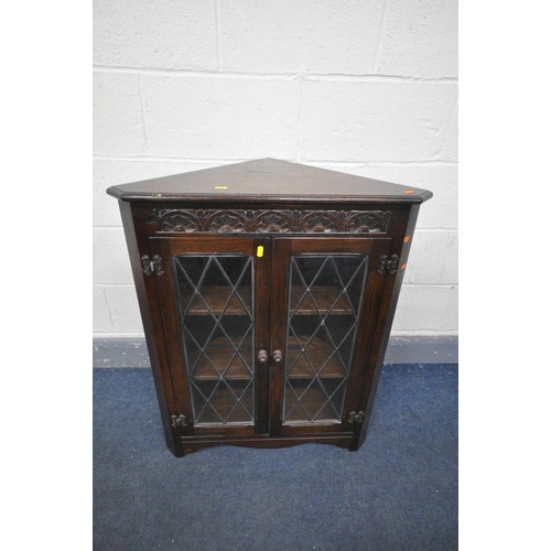 1433 - A REPRODUX MAHOGANY GLAZED CONCAVE TWO DOOR CORNER CUPBOARD, above double cupboard doors, width 92cm... 