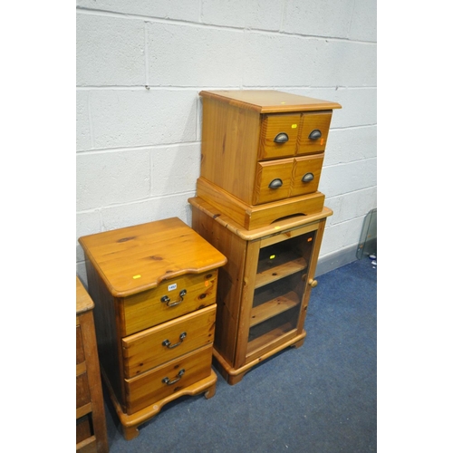 1452 - A PINE THREE DRAWER BEDSIDE CABINET, along with a pine hi-fi cabinet, two drawer cd cabinet containi... 