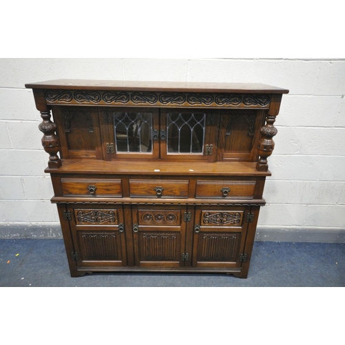 1458 - AN OLD CHARM OAK COURT CUPBOARD, with three drawers, width 138cm x depth 47cm x height 137cm (condit... 