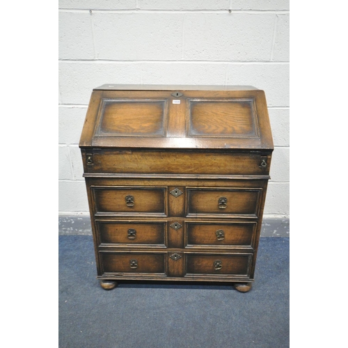 1459 - AN OAK BUREAU, with a fitted interior, and three exterior drawers, width 77cm x depth 47cm x height ... 