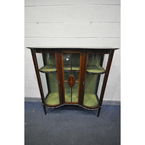 1463 - AN EDWARDIAN MAHOGANY AND MARQUETRY INLAID DISPLAY CABINET, with double bowfront cupboard doors, on ... 