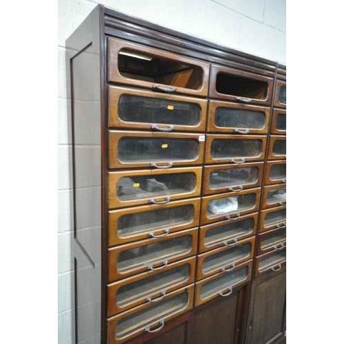 1468 - A PAIR OF EARLY 20TH CENTURY MAHOGANY HABERDASHERY CABINETS, made up of sixteen glass fronted drawer... 