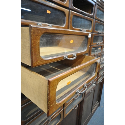 1468 - A PAIR OF EARLY 20TH CENTURY MAHOGANY HABERDASHERY CABINETS, made up of sixteen glass fronted drawer... 