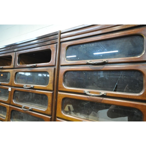 1468 - A PAIR OF EARLY 20TH CENTURY MAHOGANY HABERDASHERY CABINETS, made up of sixteen glass fronted drawer... 