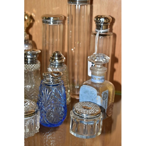 450 - A COLLECTION OF MAINLY EARLY 20TH CENTURY GLASS SCENT BOTTLES AND SIMILAR ITEMS, many with silver li... 