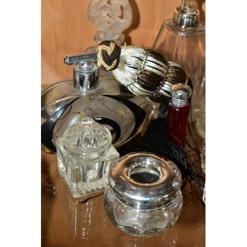 450 - A COLLECTION OF MAINLY EARLY 20TH CENTURY GLASS SCENT BOTTLES AND SIMILAR ITEMS, many with silver li... 